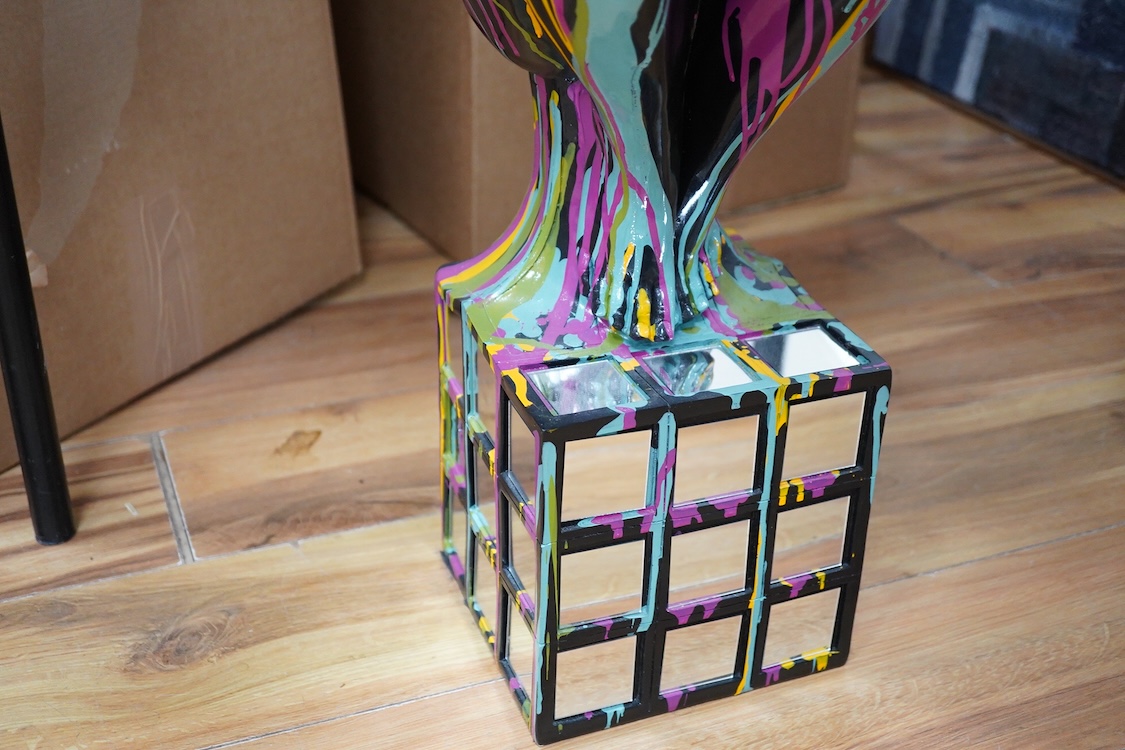 A large contemporary multicoloured composition sculpture of a diver, with mirrored base, 81cm high